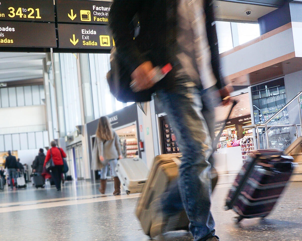 Travelers in a busy airport